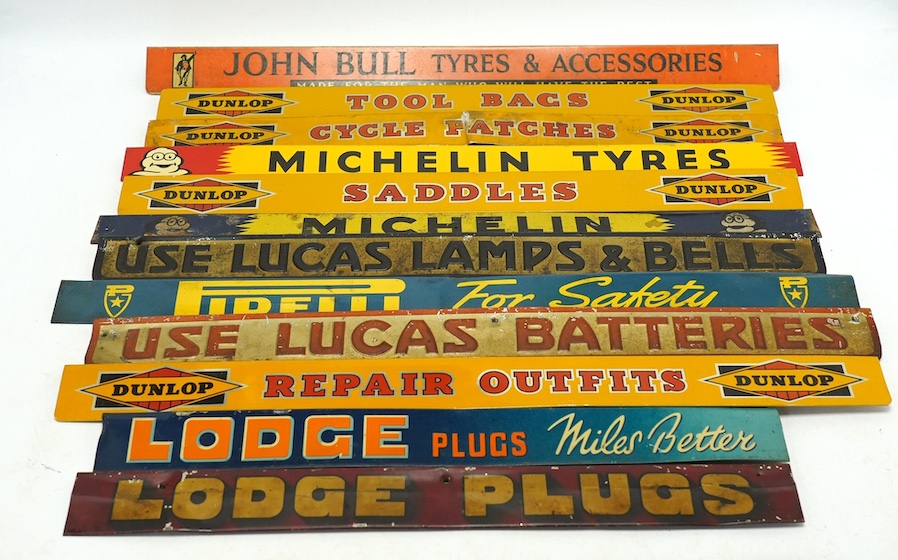 Motoring interest: twelve mid century tinplate advertising shelf strips, largest 48cm, together with a Michelin printed card advertising sign. Condition - poor, fair and good